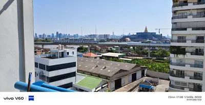 a view of a city with a train in the distance at Mansion phram6 B in Bangkok