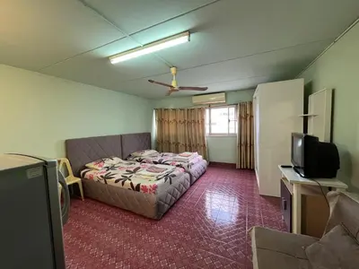 a room with a bed and a tv in it at Impact Arena C9 by Jintana in Thung Si Kan