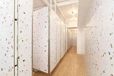 an indoor climbing gym with a climbing wall at Capsule Hostel and Thai Traditional Bath Bangkok in Bangkok