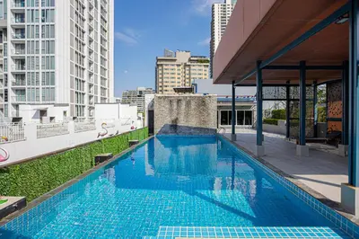 a swimming pool on the roof of a building at Dazzle Residence ByPinny2 in Bangkok
