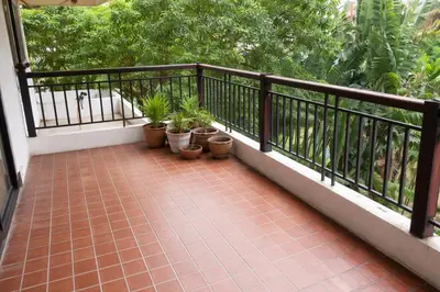 a balcony with potted plants and a railing at Big 3 bedroom apartment Asoke in Bangkok