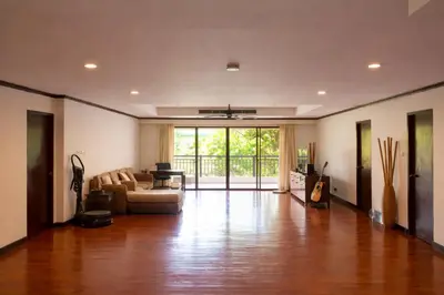 a living room with a couch and a table at Big 3 bedroom apartment Asoke in Bangkok