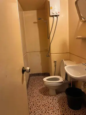 a bathroom with a toilet and a sink at Impact Arena C4 by Jintana in Ban Bang Phang