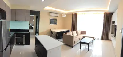 a living room with a couch and a table at Avatar Suites Hotel - SHA Extra Plus in Bangkok