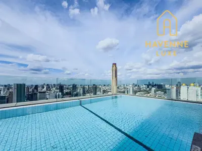 a swimming pool on the roof of a building at Luxe City Condo in Central Bangkok in Pratunam