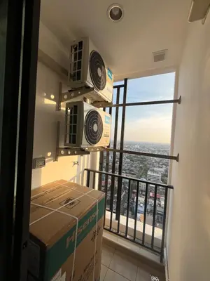 a room with a balcony with boxes in front of a window at Wutthakat new room in Bangkok