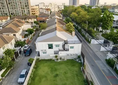 an aerial view of a white house with a green yard at Bangkoks most beautiful modern villa centre in Bangkok