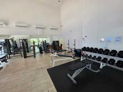 a gym with a bunch of treadms and machines at Chaophraya River high-rise river view apartment direct access to iconsiam Siam Square Chinatown 0 distance from BTS subway exit direct to Sathorn Silom Road Siam Square in Bangkok