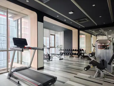 a gym with treadmills and machines in a building at Phahonyothin 35 Cozy 1BR Near BTS Chatuchak in Sathani Bang Khen