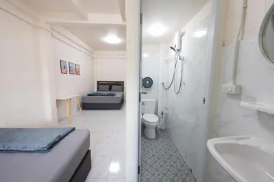 a bathroom with a bed and a toilet and a sink at ดอนเมือง 306 Near DMK Airport BTS Wat PhraSi in Bang Khen