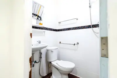 a bathroom with a toilet and a sink at XX Oh My Nap Sukhumvit 3 - นานาเหนือ in Makkasan