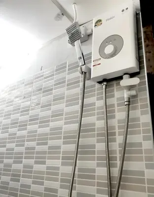 a room with a machine on the wall at Oh My Nap Sukhumvit Soi 3 - คลองเตยเหนือ in Makkasan