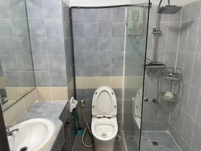 a bathroom with a toilet and a shower and a sink at BTS skytrain Phra Khanong Happy Place 1bedroom with office set in Bangkok