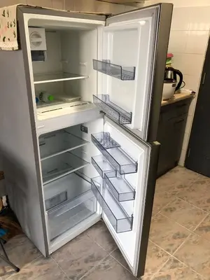 an empty refrigerator with its door open in a kitchen at BTS skytrain Phra Khanong Happy Place 1bedroom with office set in Bangkok