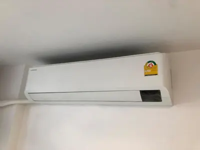 a white ceiling light with a sticker on it at BTS skytrain Phra Khanong Happy Place 1bedroom with office set in Bangkok