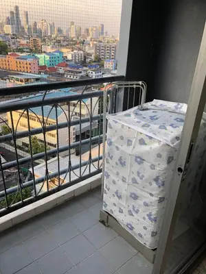 a room with a balcony with a view of a city at BTS skytrain Phra Khanong Happy Place 1bedroom with office set in Bangkok