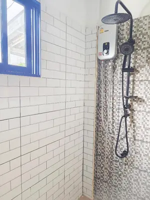 a shower with a shower curtain in a bathroom at Bangkok villa with 3 bedrooms in Ban Zong Katiam