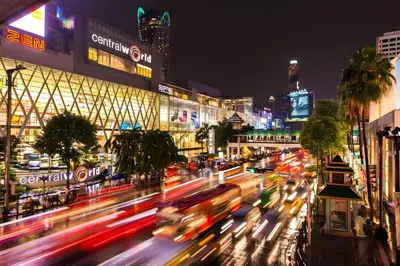 a busy city street at night with cars at Wish Inn Chidlom - Ratchadamri Bangkok in Pratunam