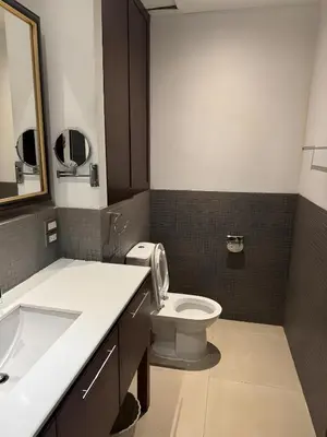 a bathroom with a toilet and a sink at Wish Inn Silom - Decho Bangkok City in Bang Rak