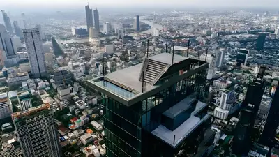 a view of a city from the top of a skyscraper at Wish Inn Silom - Decho Bangkok City in Bang Rak