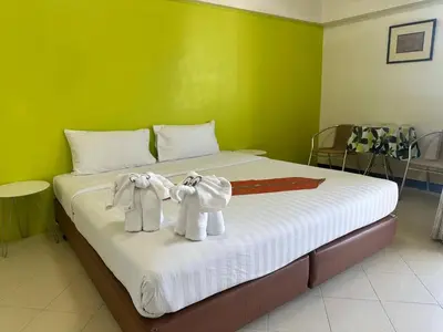 a bed with two towels on top of it at Private Apartment in city center and near BTS in Bangkok
