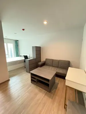 a living room with a couch and a table at Bangson Monthly rental apartment in Bang Su