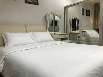 a bedroom with a white bed and a large mirror at Walking distance to Sukhumvit soi 11 Netflix 40sqm in Makkasan