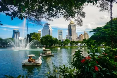 people on boats in a lake with a fountain at XX GO INN Silom - Bangrak BTS St Louis in Yan Nawa