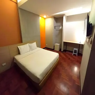a bedroom with a white bed in a room at XX GO INN Silom - Bangrak BTS St Louis in Yan Nawa