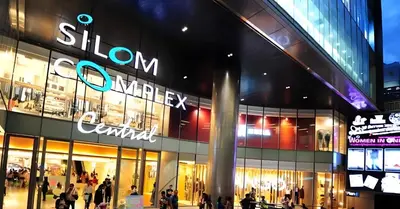 a store front of a shopping mall at night at GO INN Silom - BTS St Louis Bangkok in Yan Nawa