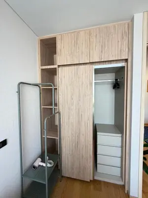 a bedroom with a bunk bed with a closet at Sky Luxury Near BTS Ekkamai pool gym Netflix in Khlong Toei