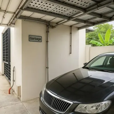 a car garage with a car parked in it at 1 BR 5 Mins BTS Bearing 7-11 and Lotus in Ban Khlong Samrong