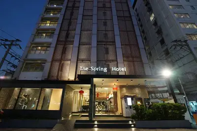 a building with a sign that reads the spring hotel at The Spring Bangkok in Bangna