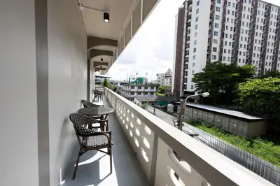 a balcony with chairs and a view of a city at ดอนเมือง 307 Near DMK Airport BTS Wat PhraSi in Bang Khen