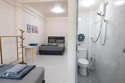 a bathroom with a bed and a shower and a toilet at ดอนเมือง 307 Near DMK Airport BTS Wat PhraSi in Bang Khen