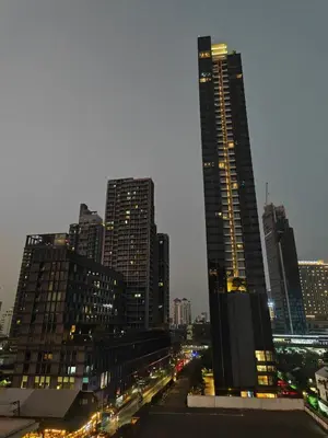 a city skyline with tall buildings at night at Modern 2BR-3 Mins Walking Distance to BTS Thonglor in Bangkok