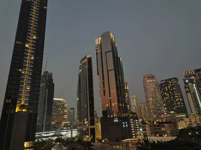 a group of tall buildings in a city at night at Modern 2BR-3 Mins Walking Distance to BTS Thonglor in Bangkok