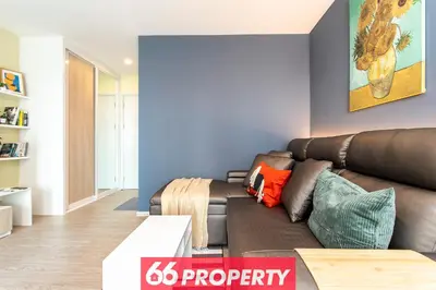 a living room with a brown leather couch at Long-Stay High Floor Apartment, Bangna, Near BTS, Malls in Bang Chak