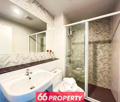 a bathroom with a shower and a sink and a toilet at Long-Stay High Floor Apartment, Bangna, Near BTS, Malls in Bang Chak