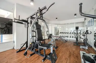a gym with several exercise bikes in a room at Breezy 1BR Near BTS Udomsuk in Amphoe Phra Khanong