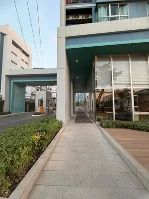 a building with a sidewalk in front of it at Lumpiniville Sukhumvit in Bangna
