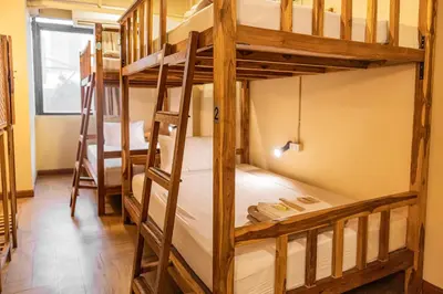 a bunk bed room with two bunk beds at Metro Pratunam Boutique Hotel in Pratunam