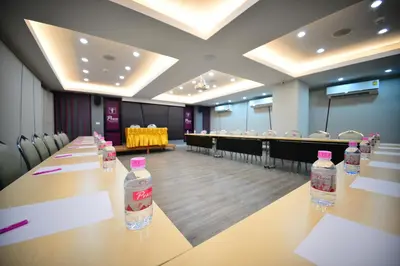 a conference room with bottles of water on a table at Praso@Ratchada12 in Bangkok