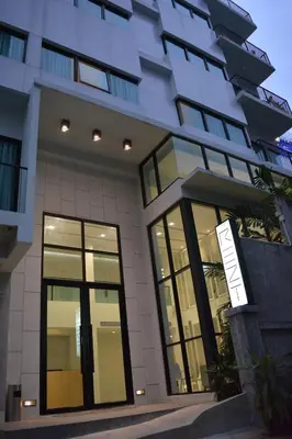a building with a sign in front of it at Rezt Bangkok in Bangkok