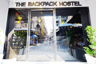 a store front with the back pack hostel on a street at The Backpack Hostel in Bangkok