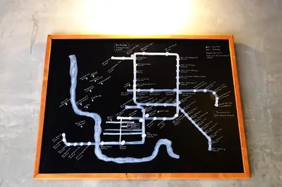 a drawing of a subway map on a chalkboard at The Backpack Hostel in Bangkok