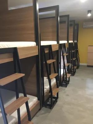 a row of bunk beds in a room at Bed@Town Hostel in Bangkok