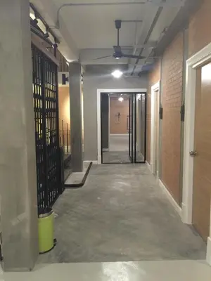 an empty hallway in an office building with a ceiling at Bed@Town Hostel in Bangkok