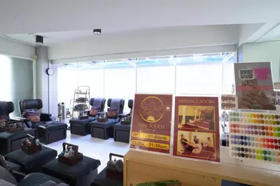 a hair salon with a bunch of chairs in a room at Cubic Pratunam in Bangkok