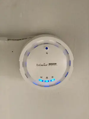 a ceiling light with blue lights on a ceiling at Oriental Smile Hotel in Bangkok